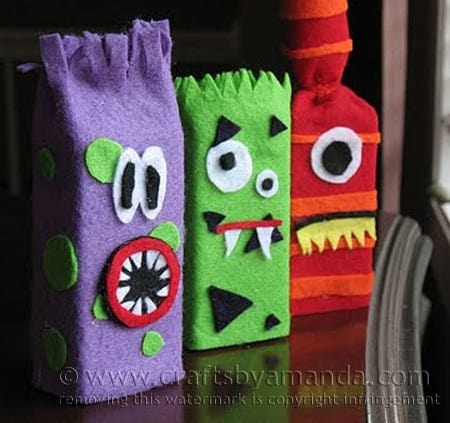 Make adorable monsters from recycled juice boxes and felt! Great for Halloween too! By Amanda Formaro of Crafts by Amanda