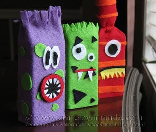 Make adorable monsters from recycled juice boxes and felt! Great for Halloween too! By Amanda Formaro of Crafts by Amanda