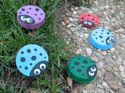 Plastic Lid Ladybugs: a cute kid's craft made from recycled milk lids!