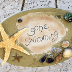plaque that says gone swimming