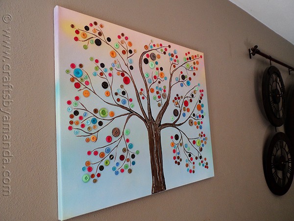 Make this beautiful button tree for your home. This button tree tutorial shows you step by step how to turn an ordinary canvas into colorful wall art!