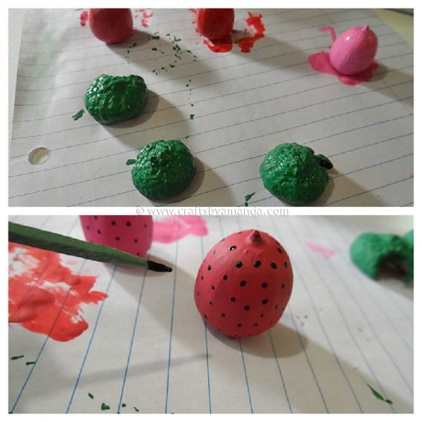 painting the strawberry acorn magnets