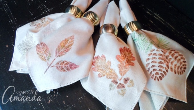 Use glitter paint to decorate plain fabric napkins. These glittery Thanksgiving napkins won't shed glitter and look great on your table!