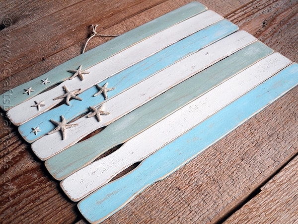 beach flag made from painted paint stir sticks