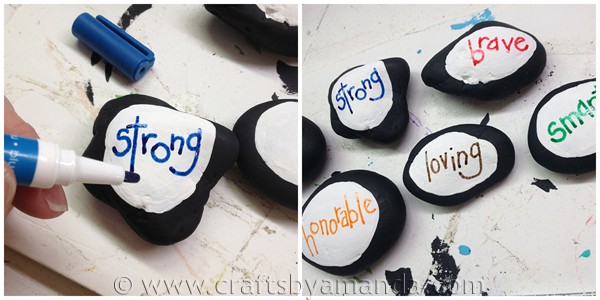 Use paint pens to write words on the painted stones