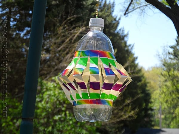 plastic bottle made into a wind spinner with colorful duct tape