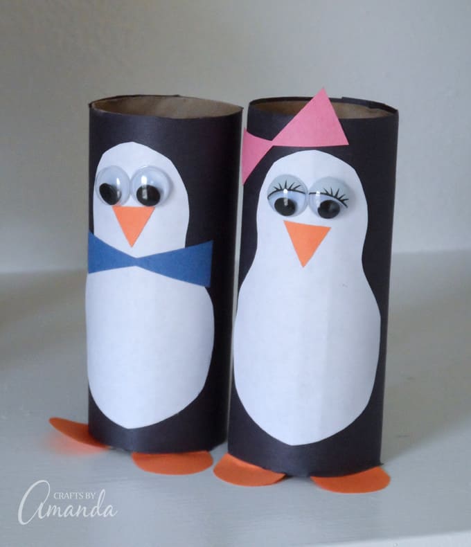 two cardboard penguins