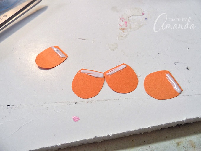 orange construction paper with glue