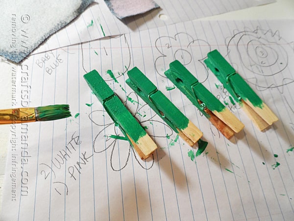 Paint the clothespins green
