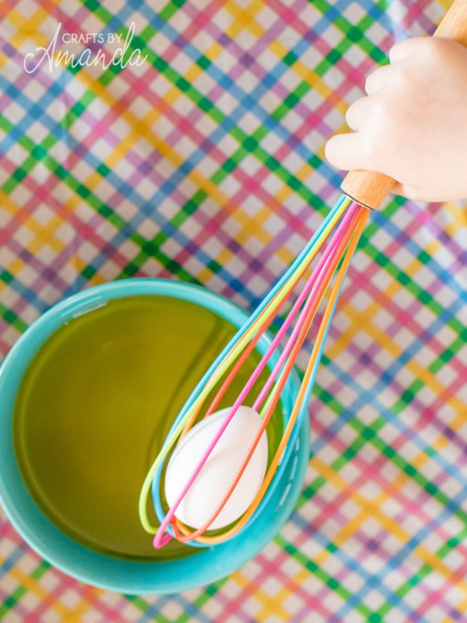 dyeing easter eggs with whisk
