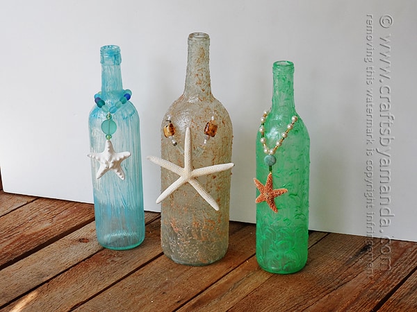 Wine bottle crafts are really popular right now, and it's summertime, so beach crafts are a hit too. I'll show you how to make these beachy wine bottles!