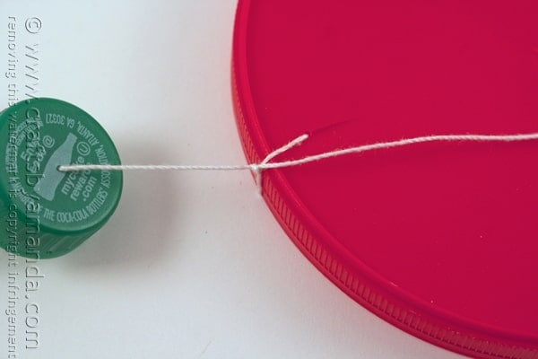 string tied onto plastic lid