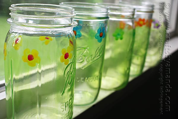 Painted Mason Jar Drinking Glasses in a row
