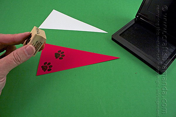 adding paw print stamps to the paper flags