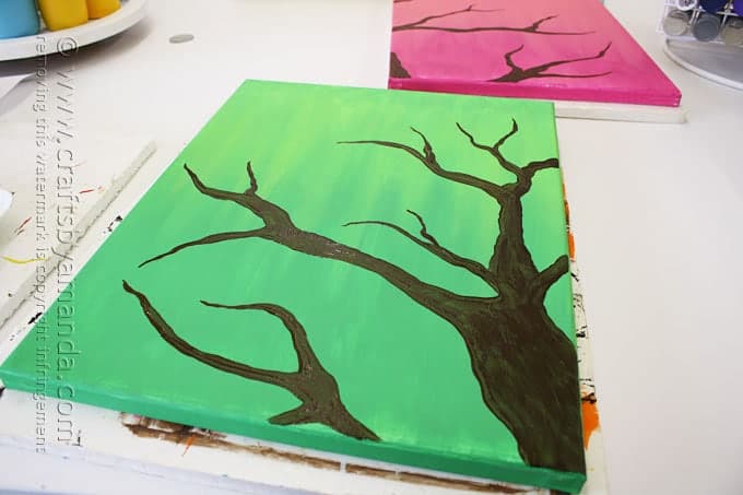 silhouette of tree branch on green canvas