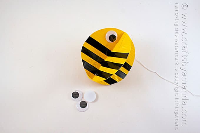 adding googly eye to bee craft