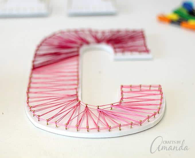 up close pink and red string art