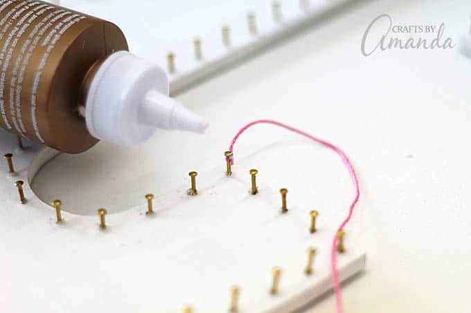 use white craft glue to secure the beginning of the string