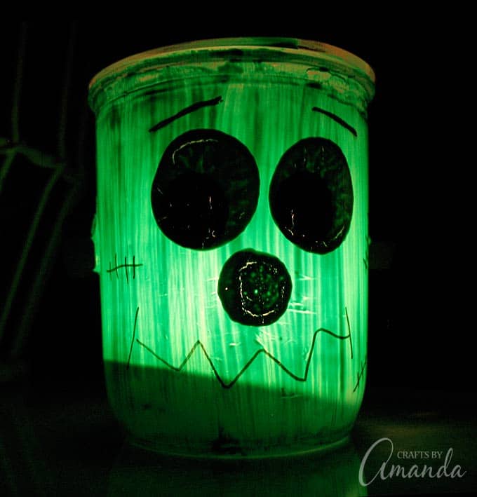 Mason jars become Frankenstein luminaries with this fun Halloween craft project!