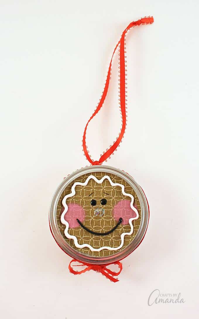 Turn a canning jar lid into a sweet gingerbread man with this canning lid ornament project!