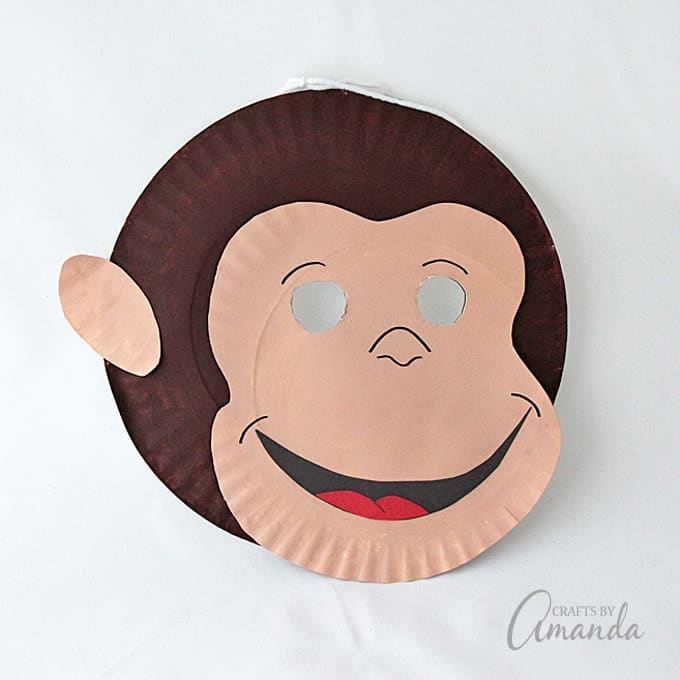 Make a fun Curious George mask out of paper plates! Curious George is now streaming only on Hulu! #CuriousGeorgeonHulu