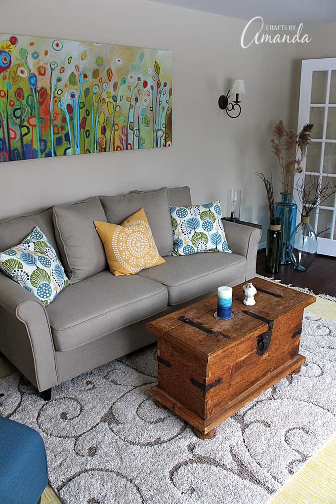 See this gorgeous living room makeover from Crafts by Amanda. A bright cheery living room with lots of windows!