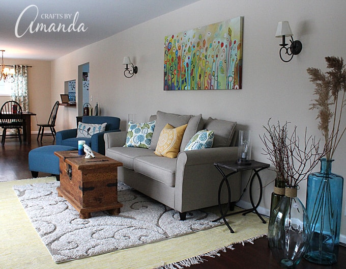 See this gorgeous living room makeover from Crafts by Amanda. A bright cheery living room with lots of windows!