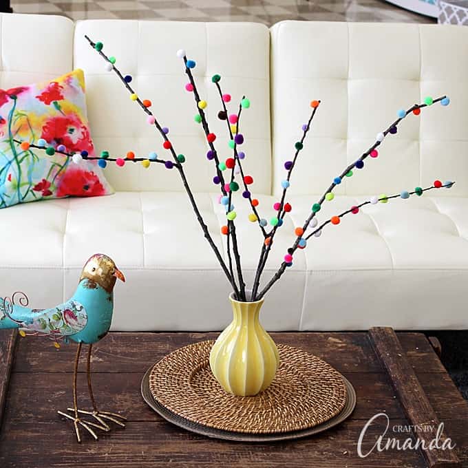 Make colorful Pom Pom Branches in about 10 minutes! A fun and colorful way to spruce up your decor or a great addition to a party table. 