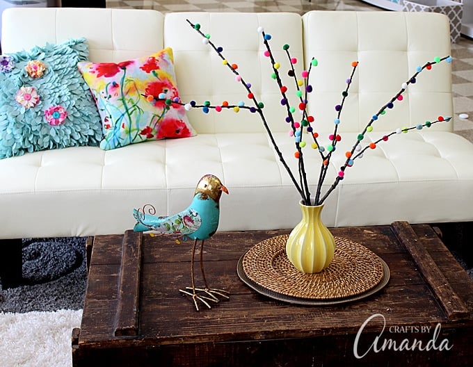 Make colorful Pom Pom Branches in about 10 minutes! A fun and colorful way to spruce up your decor or a great addition to a party table. 