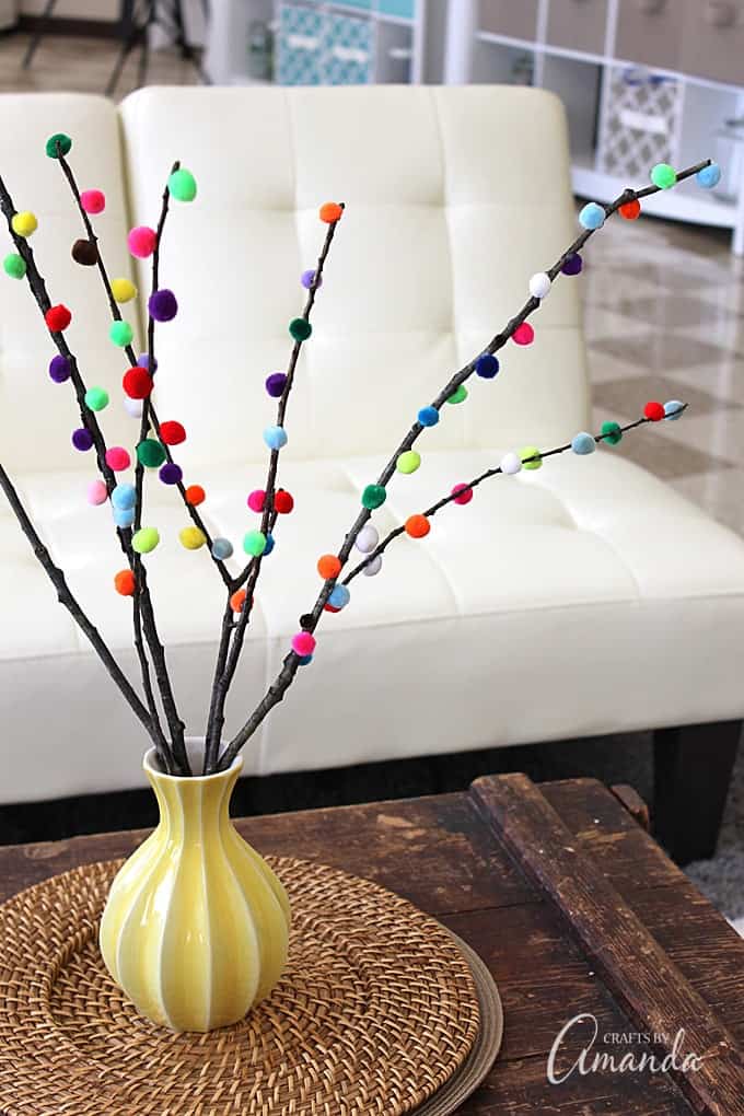 Make colorful Pom Pom Branches in about 10 minutes! A fun and colorful way to spruce up your decor or a great addition to a party table. 