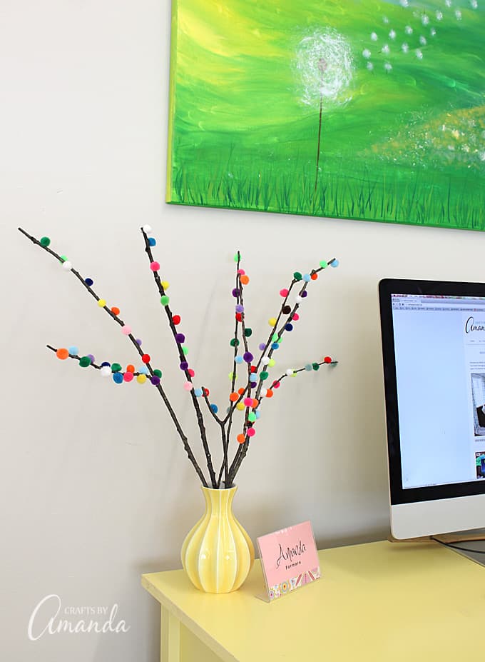Make colorful Pom Pom Branches in about 10 minutes! A fun and colorful way to spruce up your decor or a great addition to a party table. 