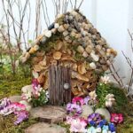 Turn an ordinary $1.00 wooden birdhouse into an adorable fairy house nestled in a moss covered outdoor fairy garden!