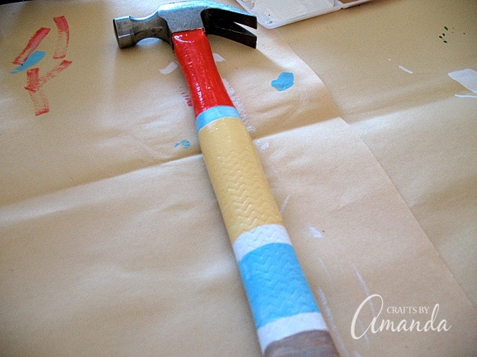Turn an ordinary hammer into this colorful painted hammer complete with dad's initial monogrammed on the handle! A personalized, unique Father's Day gift!