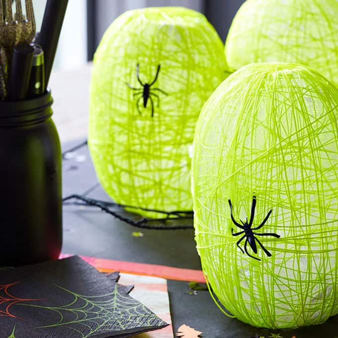 These spider nest lanterns are super cute and a fun Halloween craft for kids. Display them at your Halloween party, they will be a big hit!