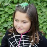 Use duct tape to create this super easy spiderweb costume, perfect for a last minute costume idea. Later remove the duck tape and your clothes are fine!