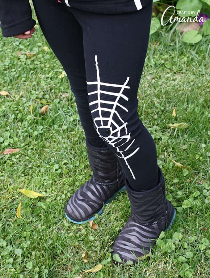 Use duct tape to create this super easy spiderweb costume, perfect for a last minute costume idea. Later remove the duck tape and your clothes are fine!