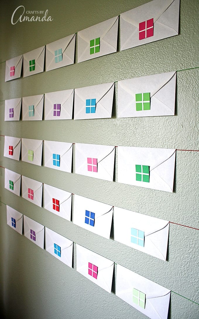 Why not start a new Christmas tradition with your kids by creating a simple envelope advent calendar using no more than plain white envelopes and colored paper.