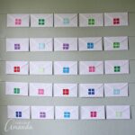 Hang your envelope advent calendar using wall putty and string