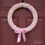 You've probably seen a variation or two of the conversation heart wreath, and I'm going to show you how to make one. It's easy and adorable!