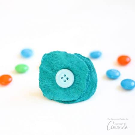 These rings dress up any outfit, and you only need an old T-shirt and a few minutes to make them, which means, if you're getting dressed for your day or night and want a statement piece before you head out, you can make one of these flower T-Shirt rings.