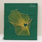 How to make state string art using embroidery floss, small nails, craft glue, and a wooden board. Customize this wall art to your beloved home state!