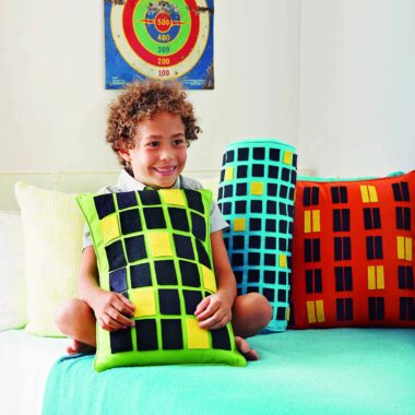 Graphic and bold, this easy-to-make throw pillow can double as a backdrop for imaginative play.