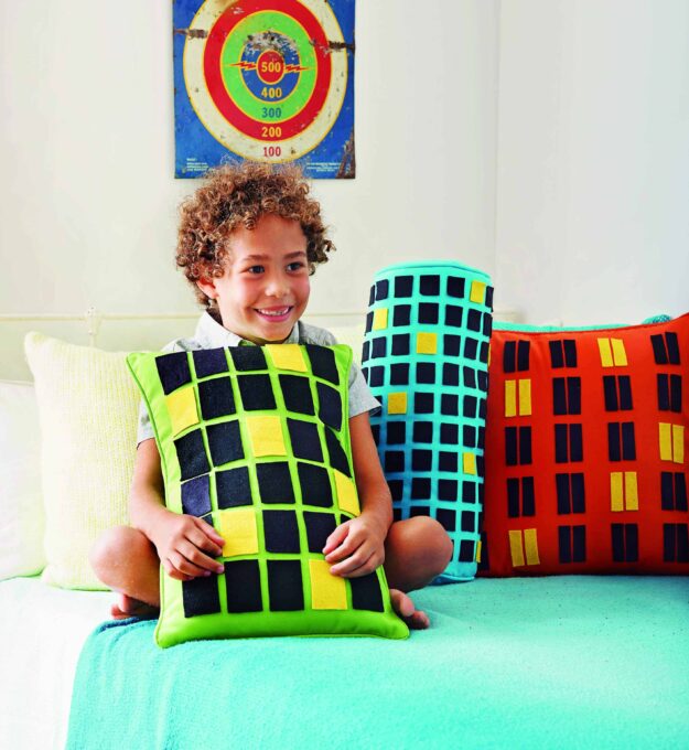Graphic and bold, this easy-to-make throw pillow can double as a backdrop for imaginative play. 