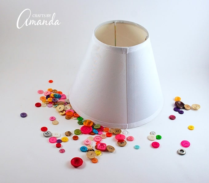 Lamp shade and colorful buttons surrounding it