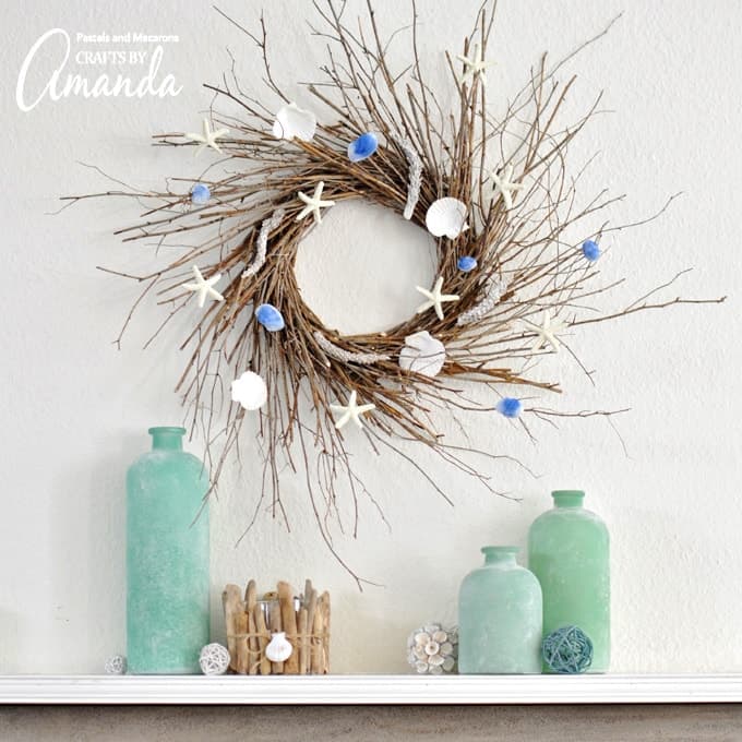 Coastal twig wreath with starfish and seashells hanging on the wall