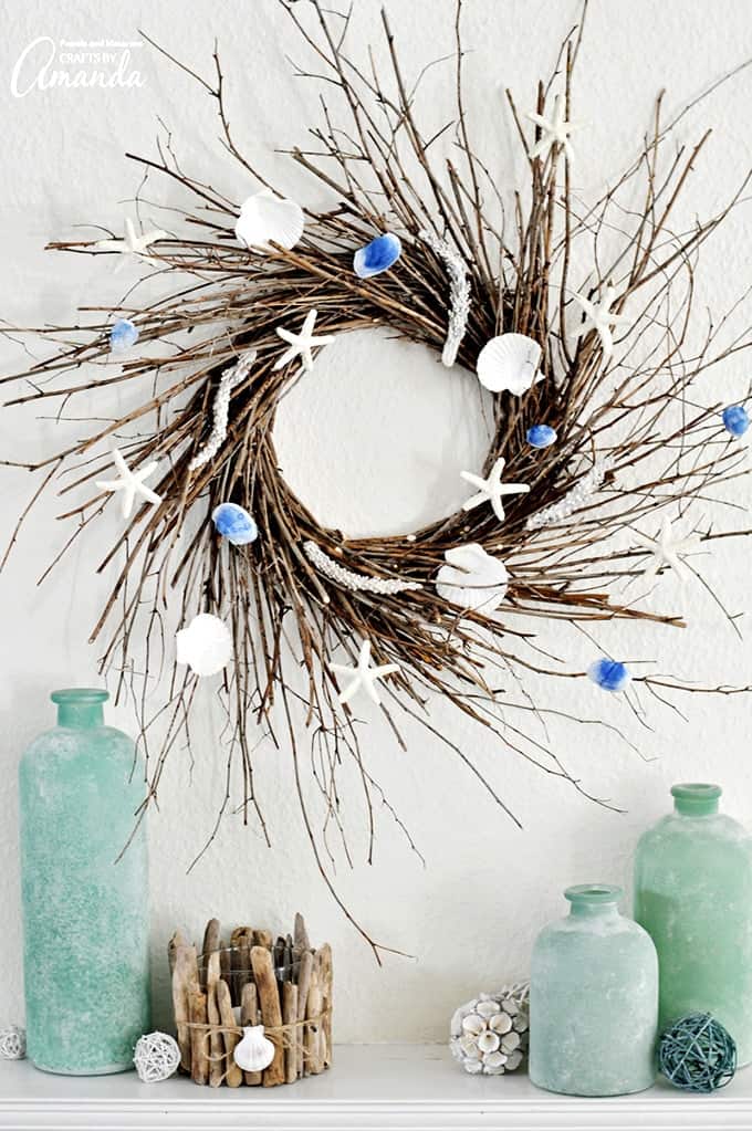 Coastal twig wreath with seashells and starfish hanging on the wall