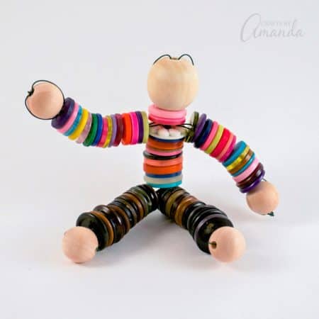 You're done making your button doll! Now pose him however you want.