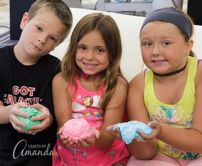 kids holding homemade floam