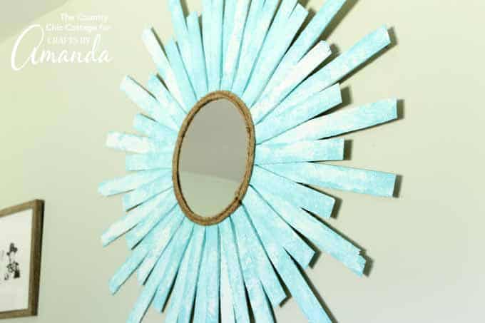 Sunburst Mirror made with wood shims hanging on wall