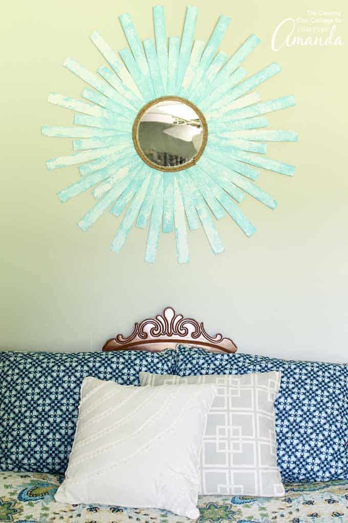 Sunburst Mirror above bed